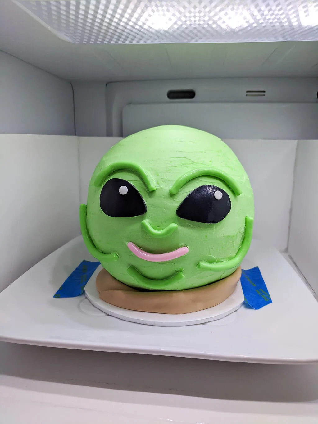 Baby Yoda head cake chilling in the refrigerator