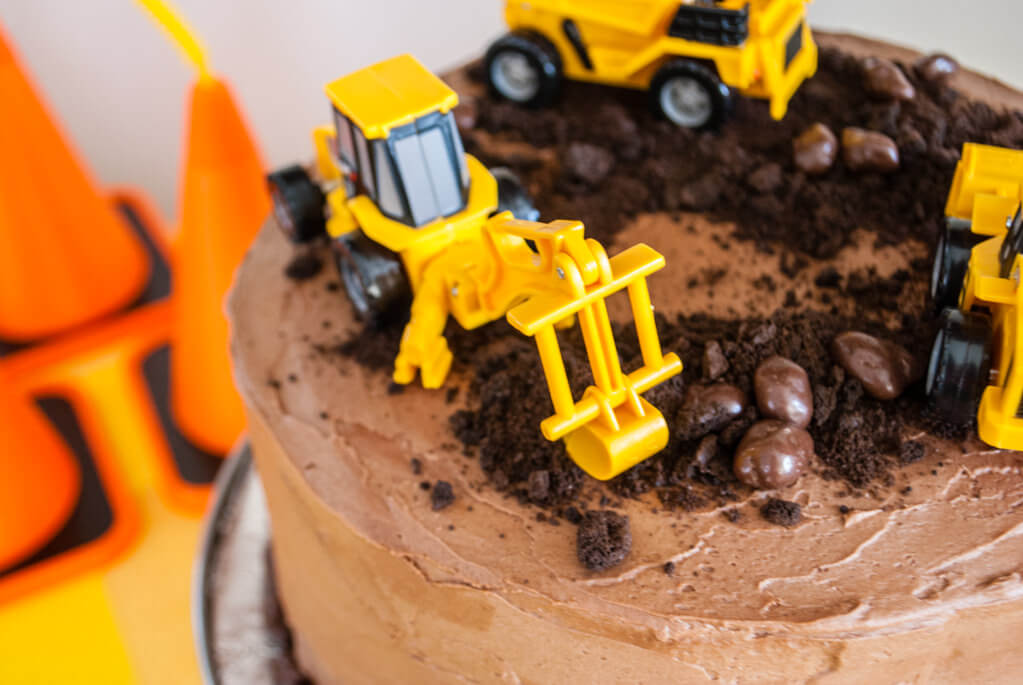 Digger cake toppers on construction cake