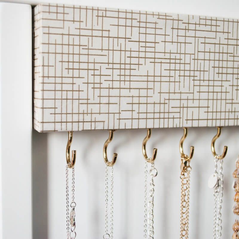 How to make an easy DIY jewelry organizer. Takes just a couple hours to create. No more tangled necklaces!