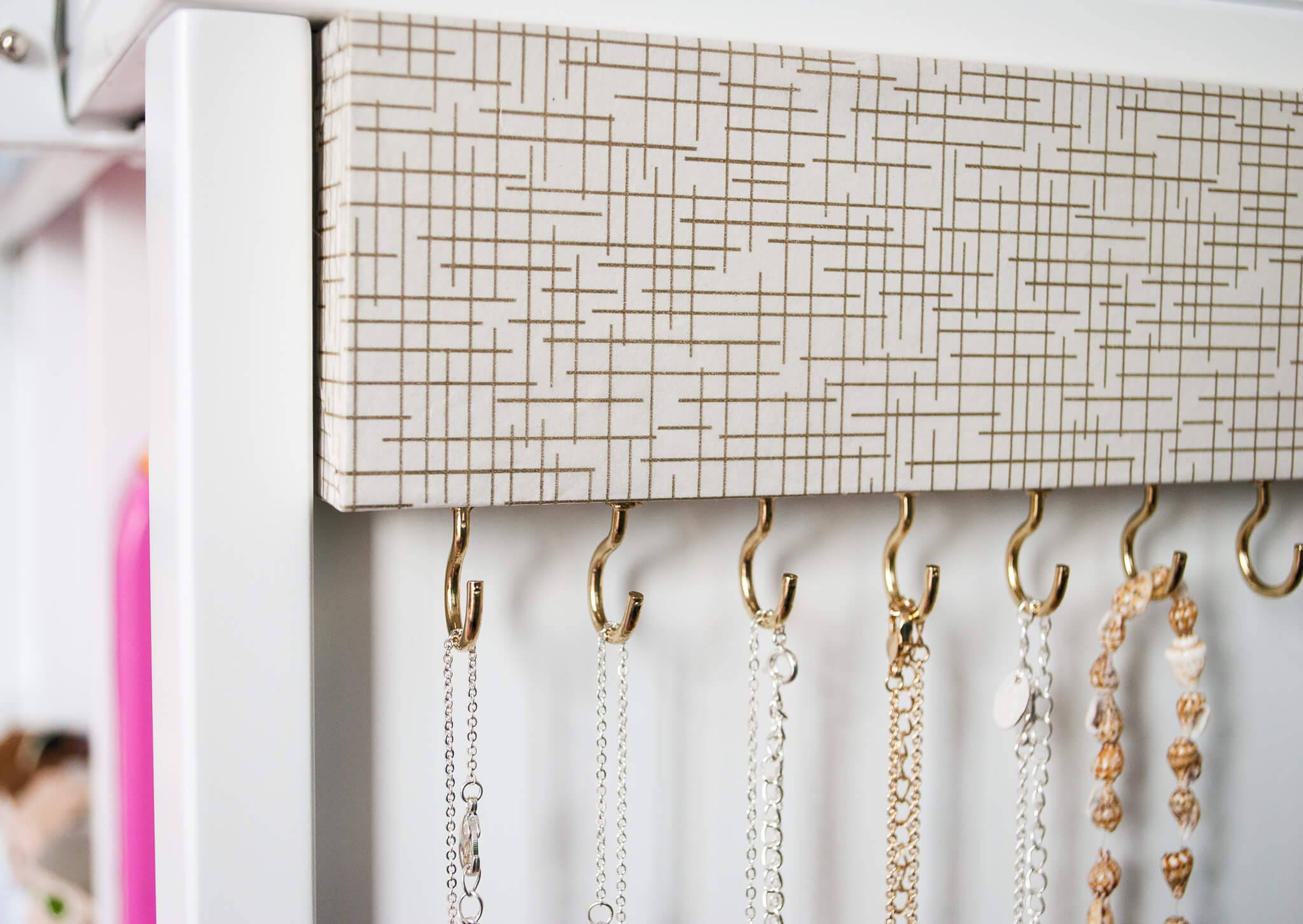How to make an easy DIY jewelry organizer. Takes just a couple hours to create. No more tangled necklaces!