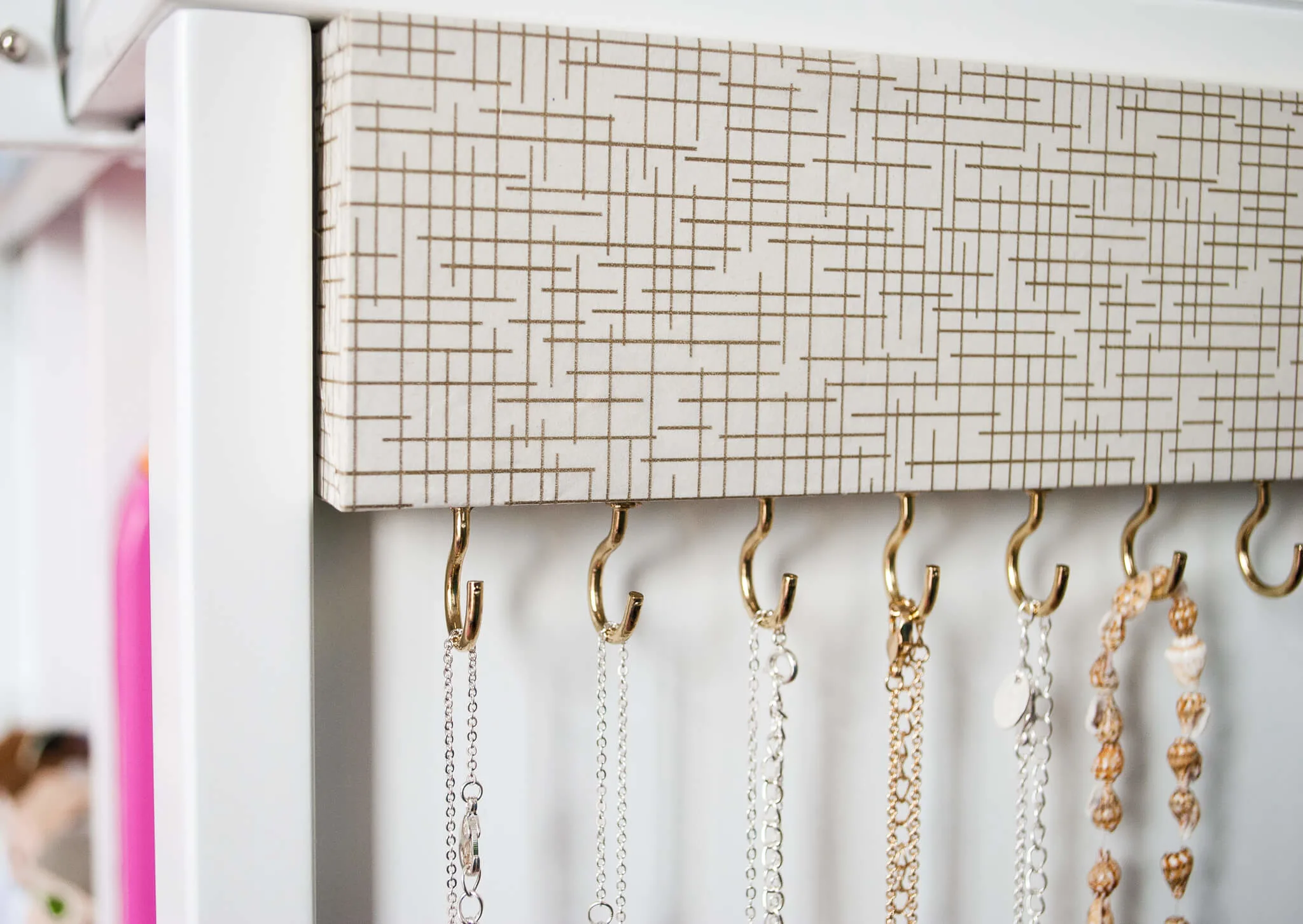 How to make an easy DIY jewelry organizer. Takes just a couple hours to create. No more tangled necklaces!