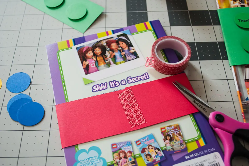 I made these easy personalized DIY book wraps - it's a great LEGO birthday party favor idea