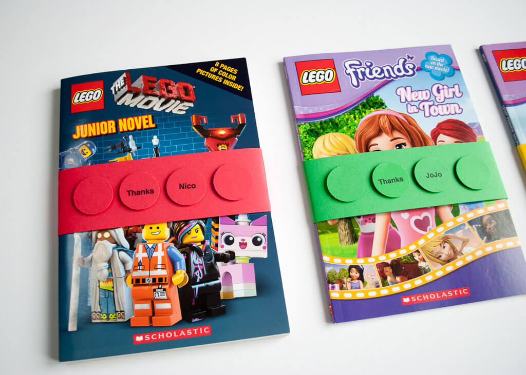 Make paper personalized LEGO bricks into book wraps - makes the best LEGO birthday party favors