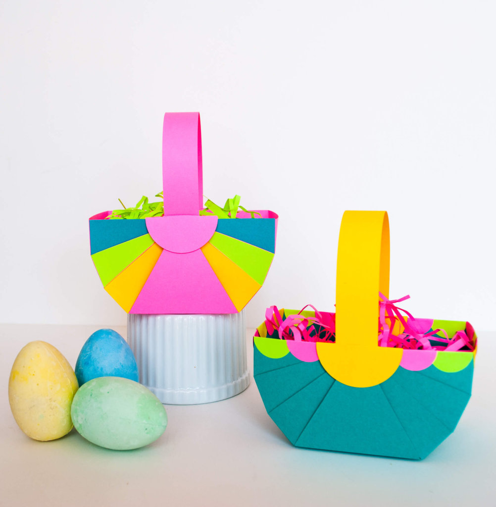 Pretty DIY Paper Easter Baskets. Make these quick and easy paper Easter baskets with this free printable template and just a few cuts and folds. Hop to it!