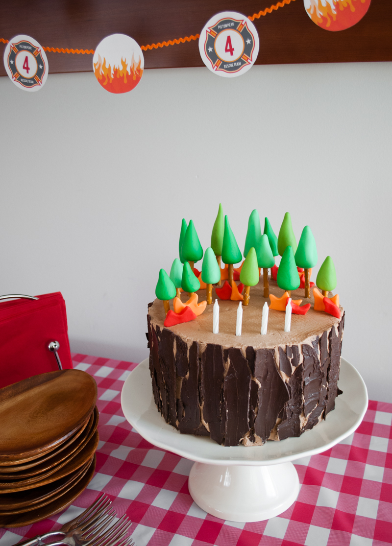 Easy DIY Planes Fire & Rescue Birthday Cake for your little fireman. This cute forest trees and flames cake is simple for beginners. Firemen Dusty, Blaze, Dipper and Windlifter are on their way to put out the forest fire in Piston Peak National Park! A trees birthday cake would be cute for a camping birthday party too.