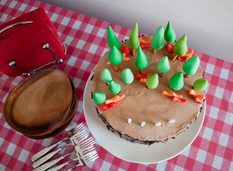 Easy DIY Planes Fire & Rescue Birthday Cake for your little fireman. This cute forest trees and flames cake is simple for beginners. Firemen Dusty, Blaze, Dipper and Windlifter are on their way to put out the forest fire in Piston Peak National Park! A trees birthday cake would be cute for a camping birthday party too.