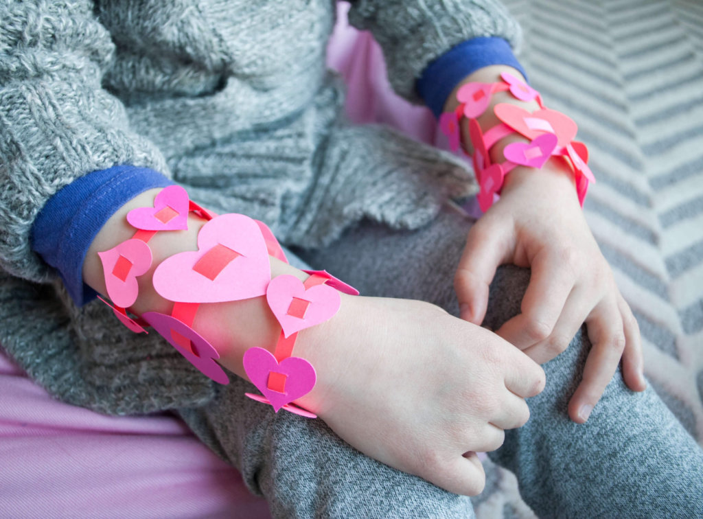 Easy DIY paper heart bracelets for Valentine's Day. I love this sweet Valentine's Day kids craft! #Colorize