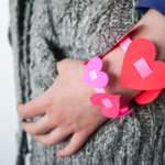 Easy DIY paper heart bracelets for Valentine's Day. I love this sweet Valentine's Day kids craft! #Colorize