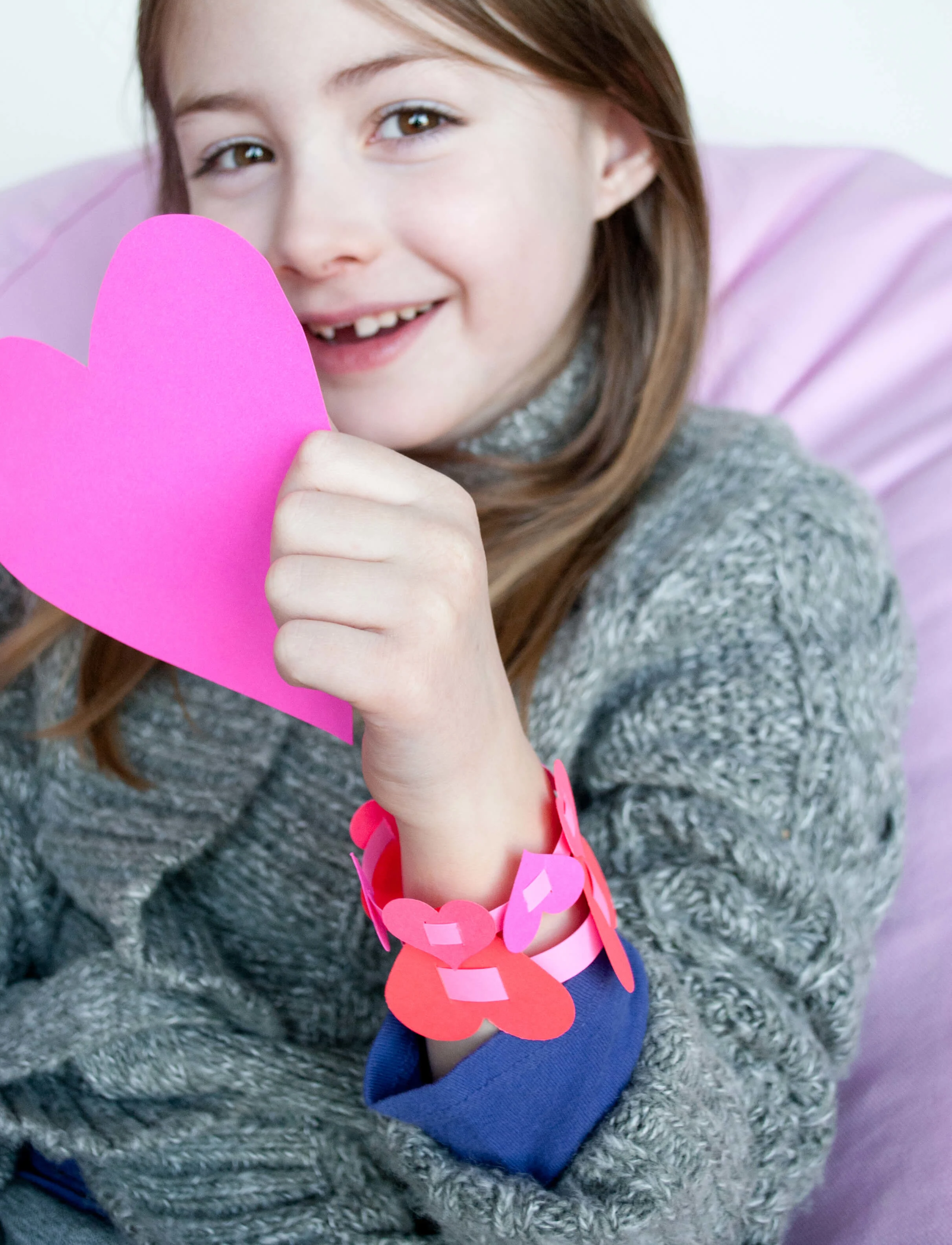 Easy DIY paper heart bracelets for Valentine's Day. I love this sweet Valentine's Day kids craft! #Colorize