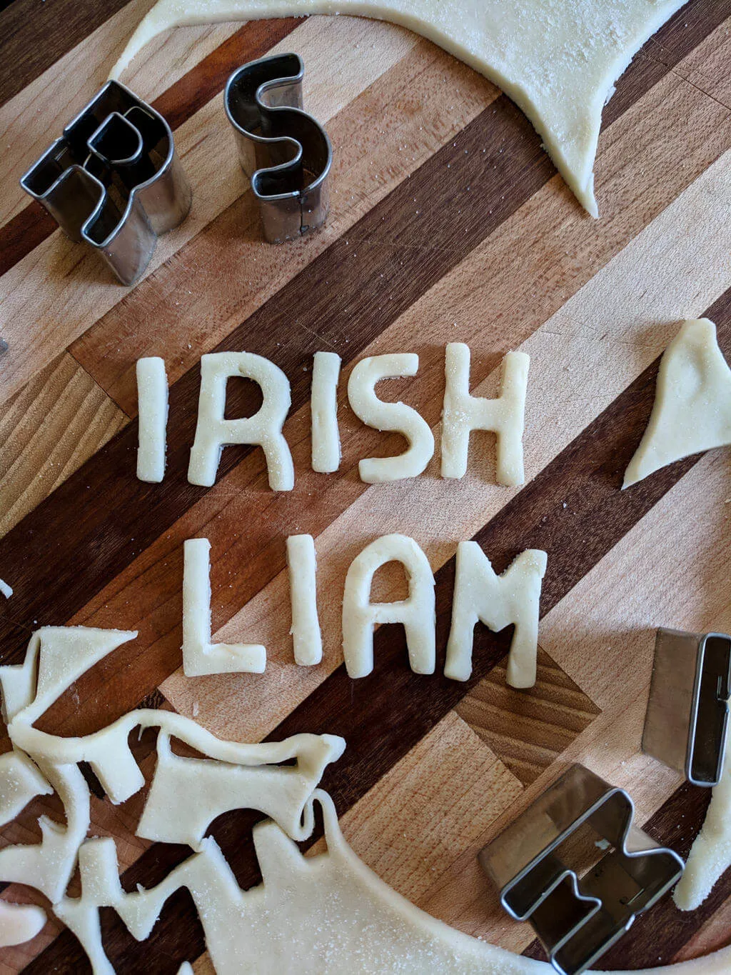 Letters cut from pie crust using cookie cutters