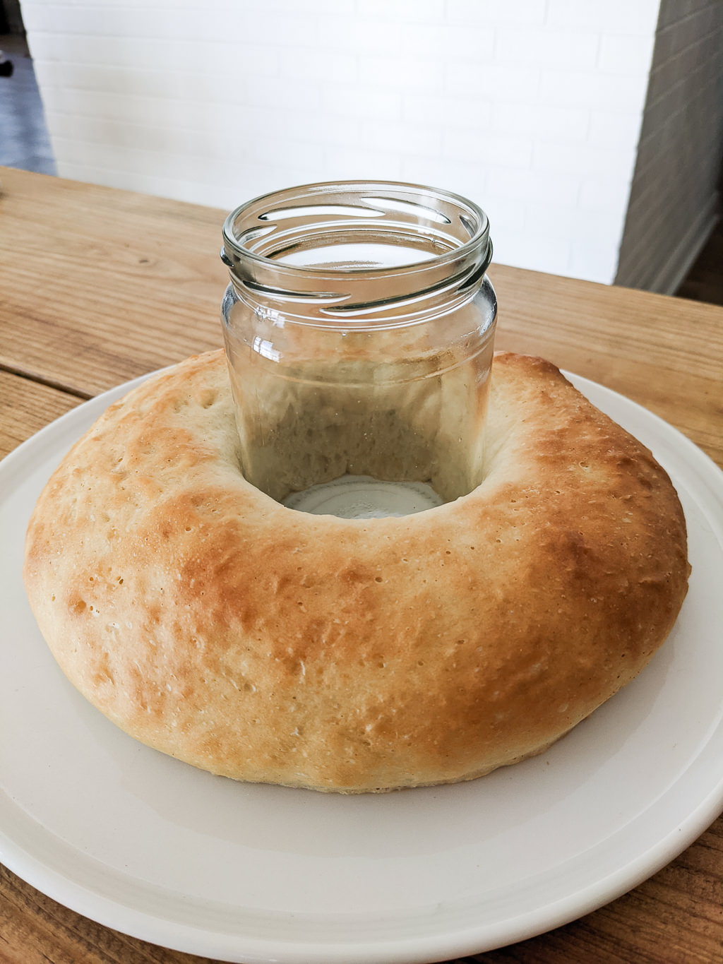 Using a ball jar to help a King Cake keep its shape while proofing