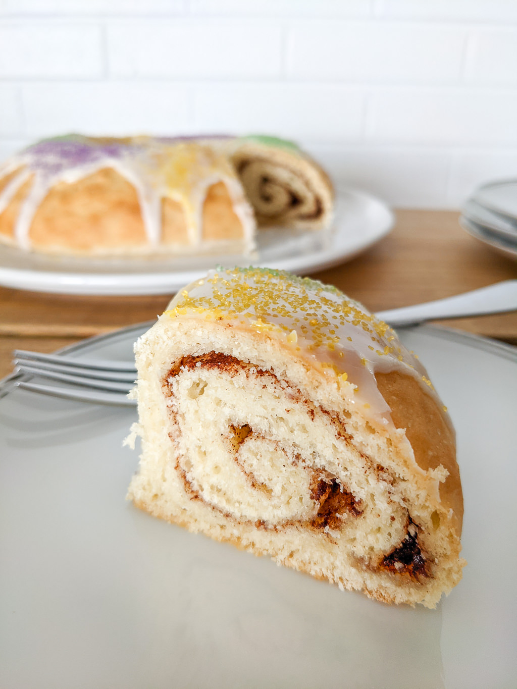 King Cake slice that shows the cinnamon roll swirl