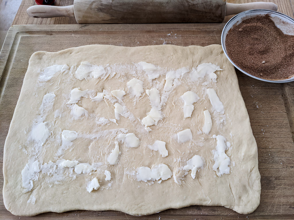 Making a cinnamon roll King Cake