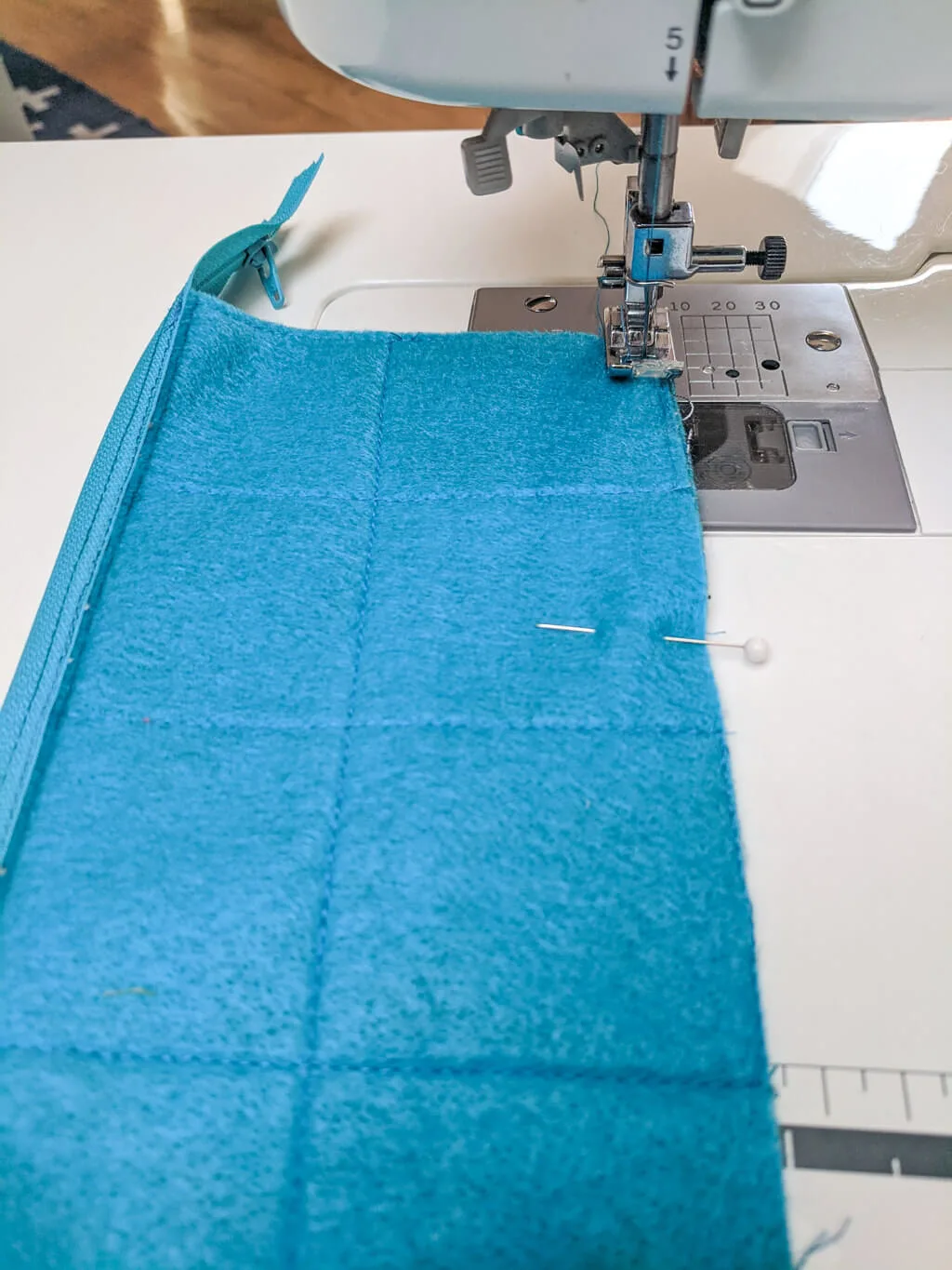 Sewing bottom seam of a DIY pencil pouch with zipper