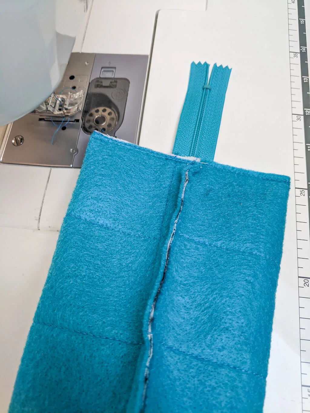Sewing side seams of a DIY pencil pouch with zipper