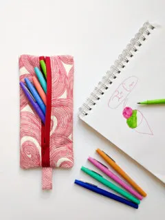 DIY pencil case with markers and a drawing