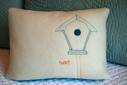 Embroidered birdhouse pillow using tissue paper pattern
