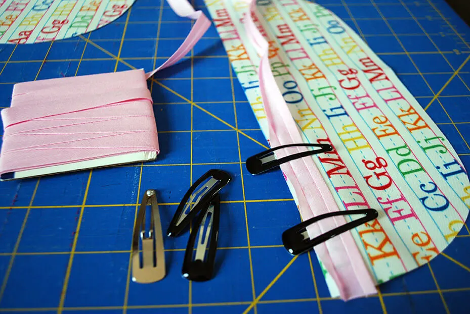 Sewing bias tape on a baby bib pocket