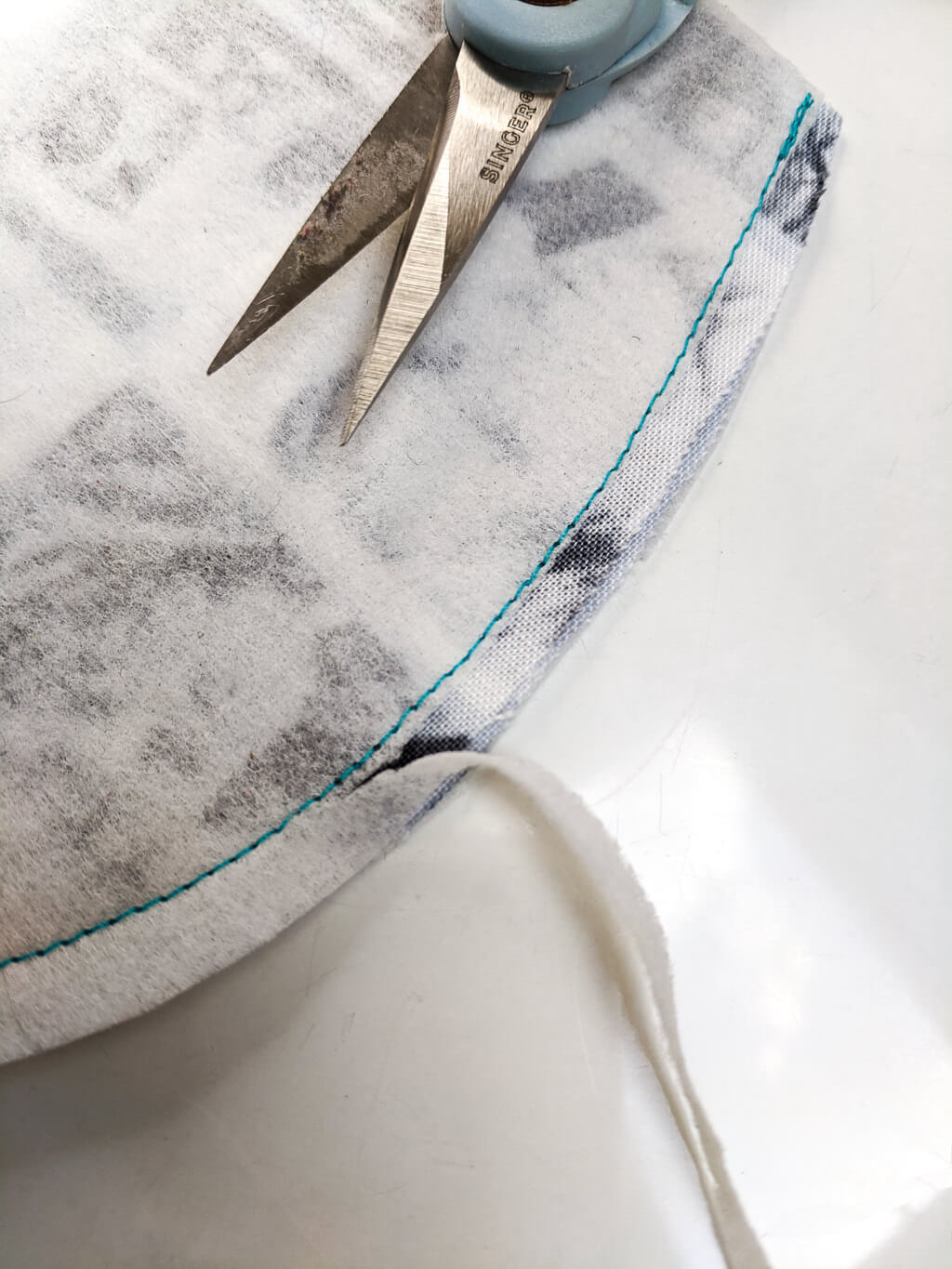 Trimming away interfacing from seams in face masks