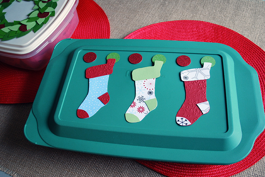 Stockings decoration on food storage container lids for pot lucks and cookie exchanges