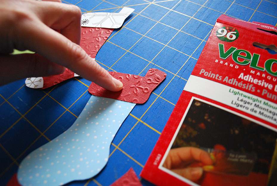 Stockings decoration on food storage container lids for pot lucks and cookie exchanges