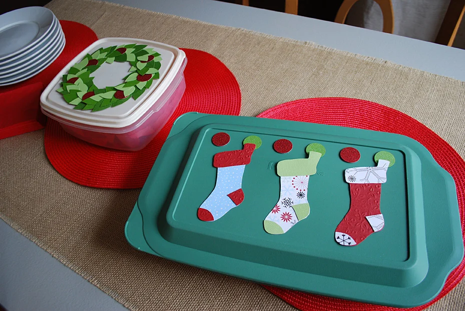 Stockings decoration on food storage container lids for pot lucks and cookie exchanges