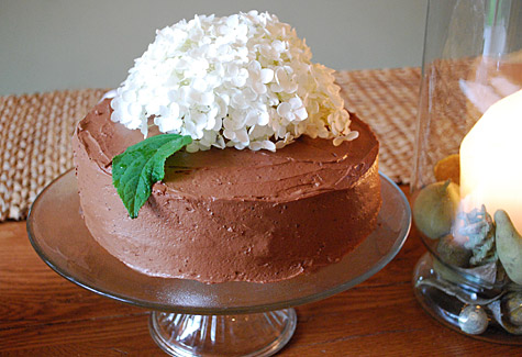 Flower topped birthday cake with chocolate icing