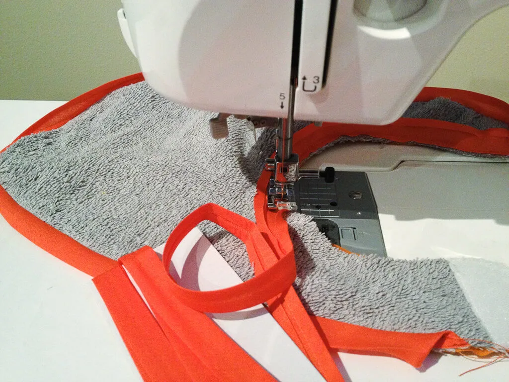 DIY free baby bib sewing pattern - how to sew bias tape around a baby bib