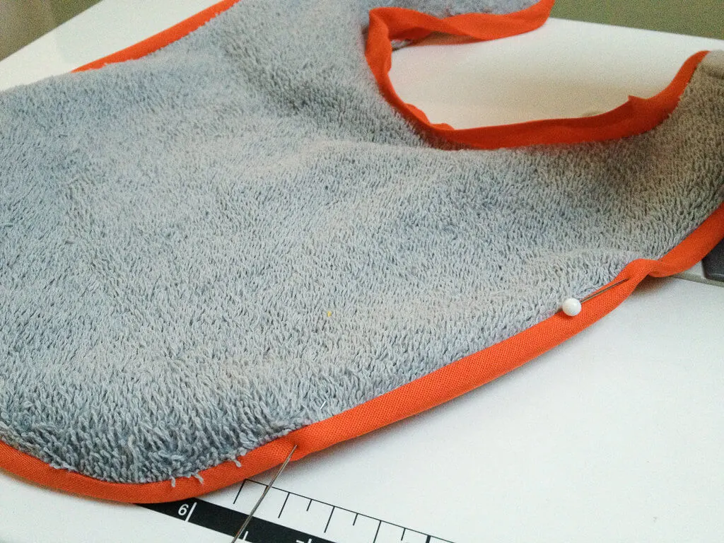 DIY free baby bib sewing pattern - how to sew bias tape around a baby bib