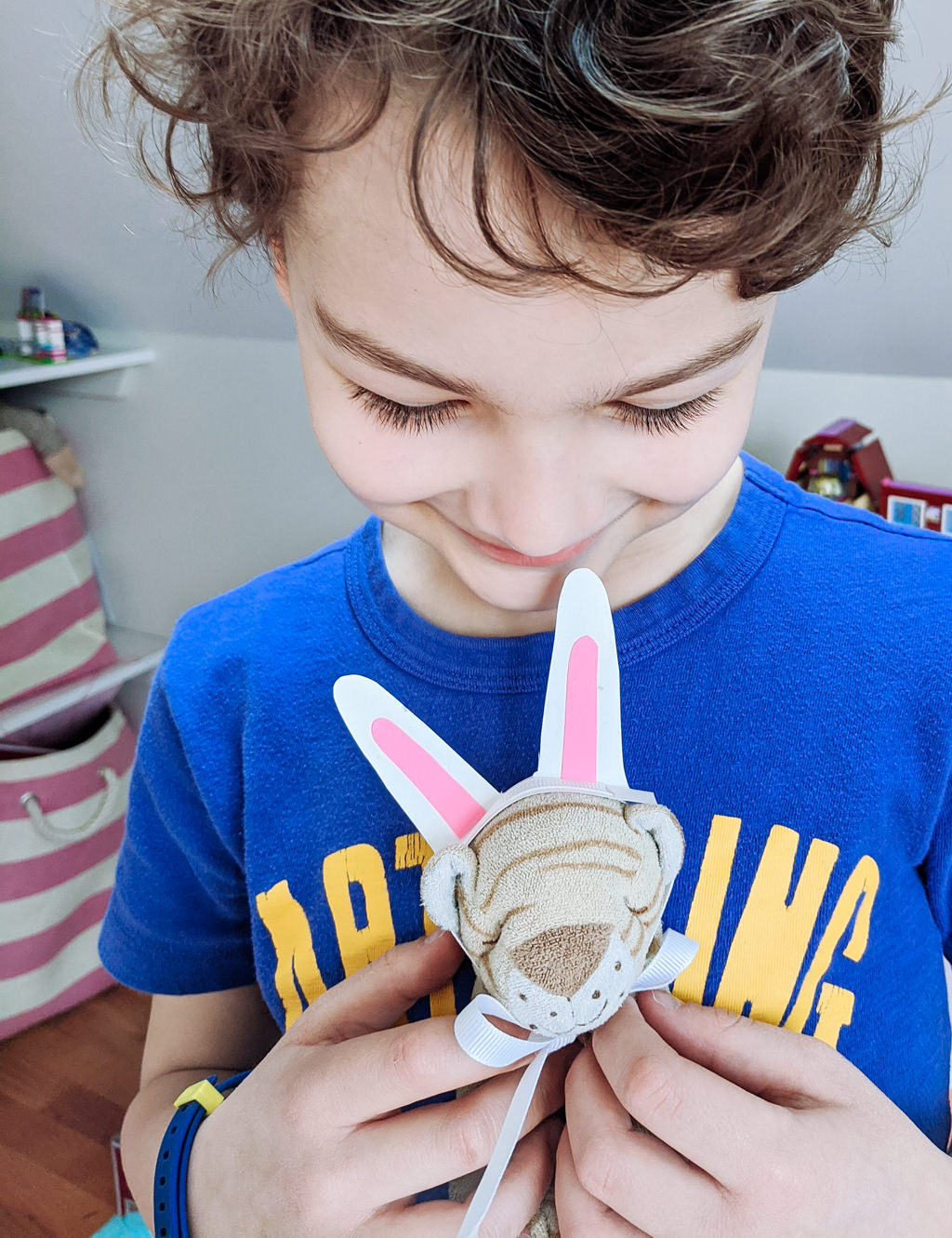 Liam with Tiger dressed for Easter. Copyright Merriment Design. Do not use without written permision.