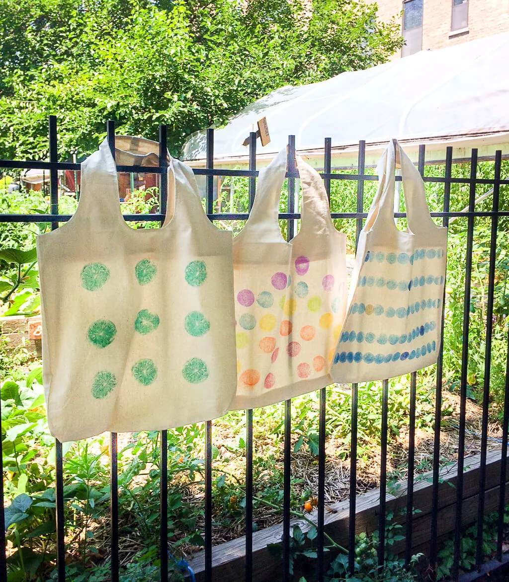 DIY fruit and vegetable stamped reusable grocery bags. Use lemons, carrots, onions and more as stamps!