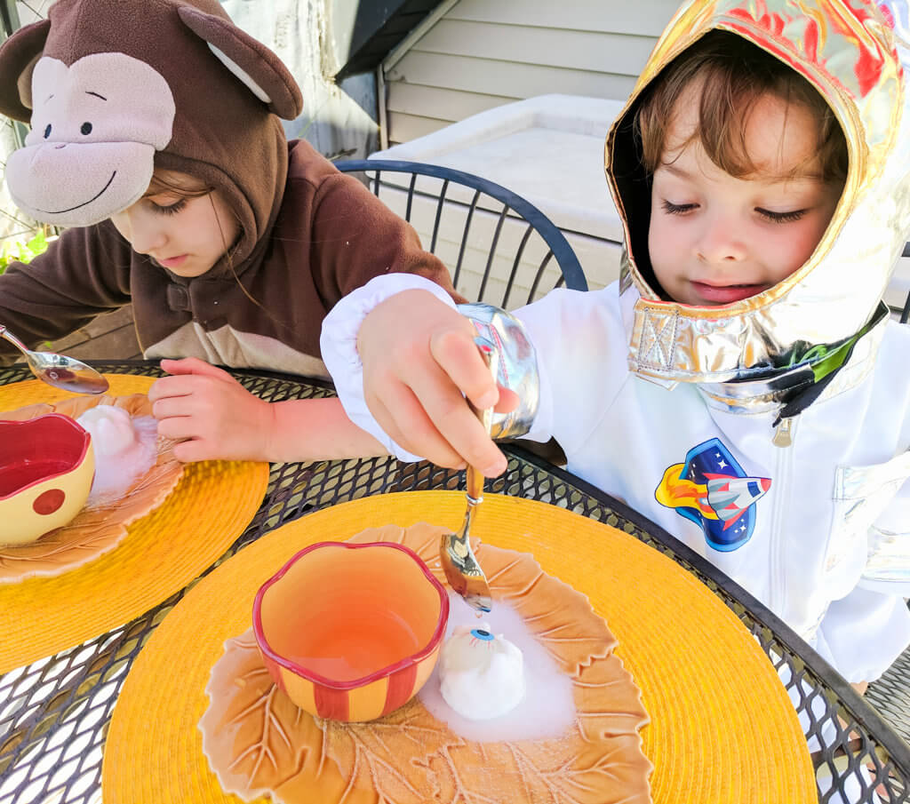 Fun kids Halloween party game: Eyeball surprise! Freeze glow-in-the-dark eyeball bouncy balls in baking soda and water, then spoon on vinegar to reveal.