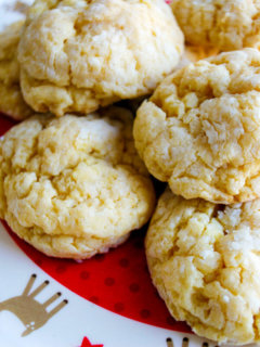 Ooey gooey butter cookies recipe - you'll never guess that these delicious cookies come from a yellow cake mix! Make these St. Louis quick and easy cake mix cookies from scratch for Christmas cookie exchanges and school celebrations. #ooey #gooey #butter #cookies #recipe #cake #mix #easy #yellow #christmas #scratch