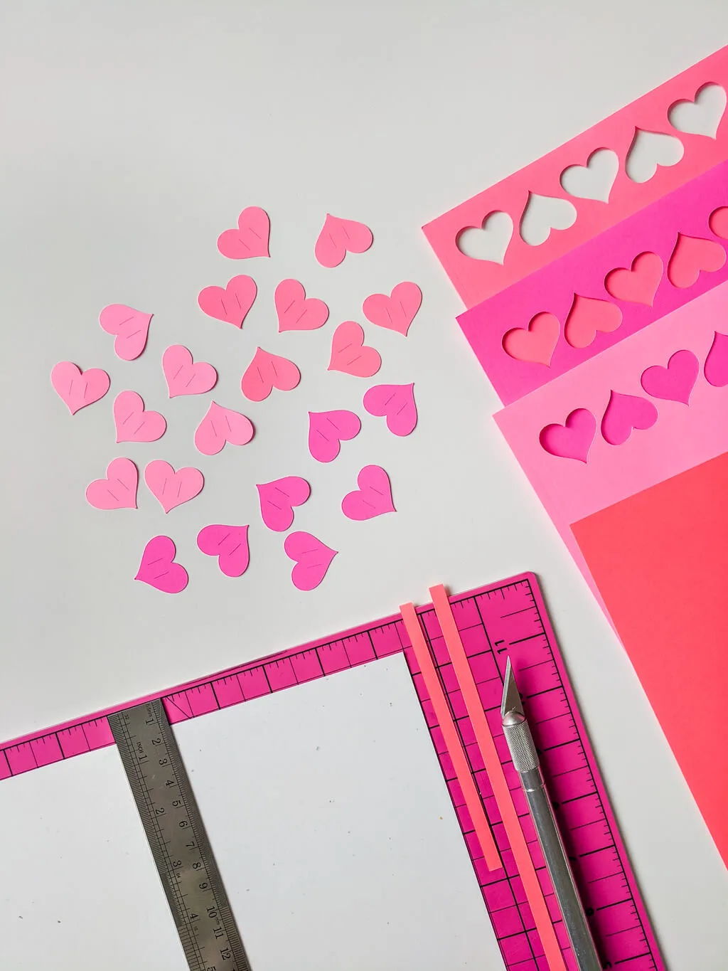 Cut paper hearts for a handmade Valentines Day card