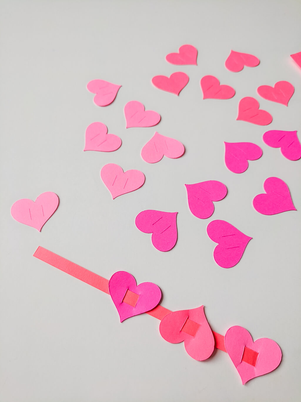 Weaving paper hearts for a Valentine's Day card