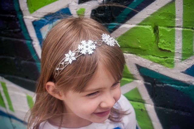 DIY Frozen snowflake headband for your little Elsa. Just print this download onto Shrinky Dink shrink film, cut, bake, and glue to a headband. Perfect for a Frozen birthday party or Elsa Halloween costume!