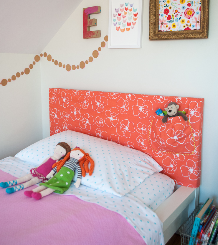 How to make a DIY headboard slipcover with a super cute storage pocket. What a cute way to temporarily update a bedroom! You can hack an IKEA Malm bed or make the slipcover for your own headboard!