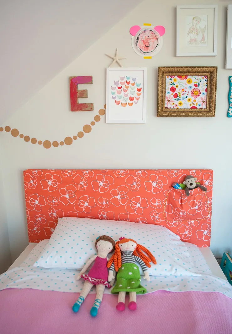 Learn how to make a headboard slipcover with storage pocket @merrimentdesign