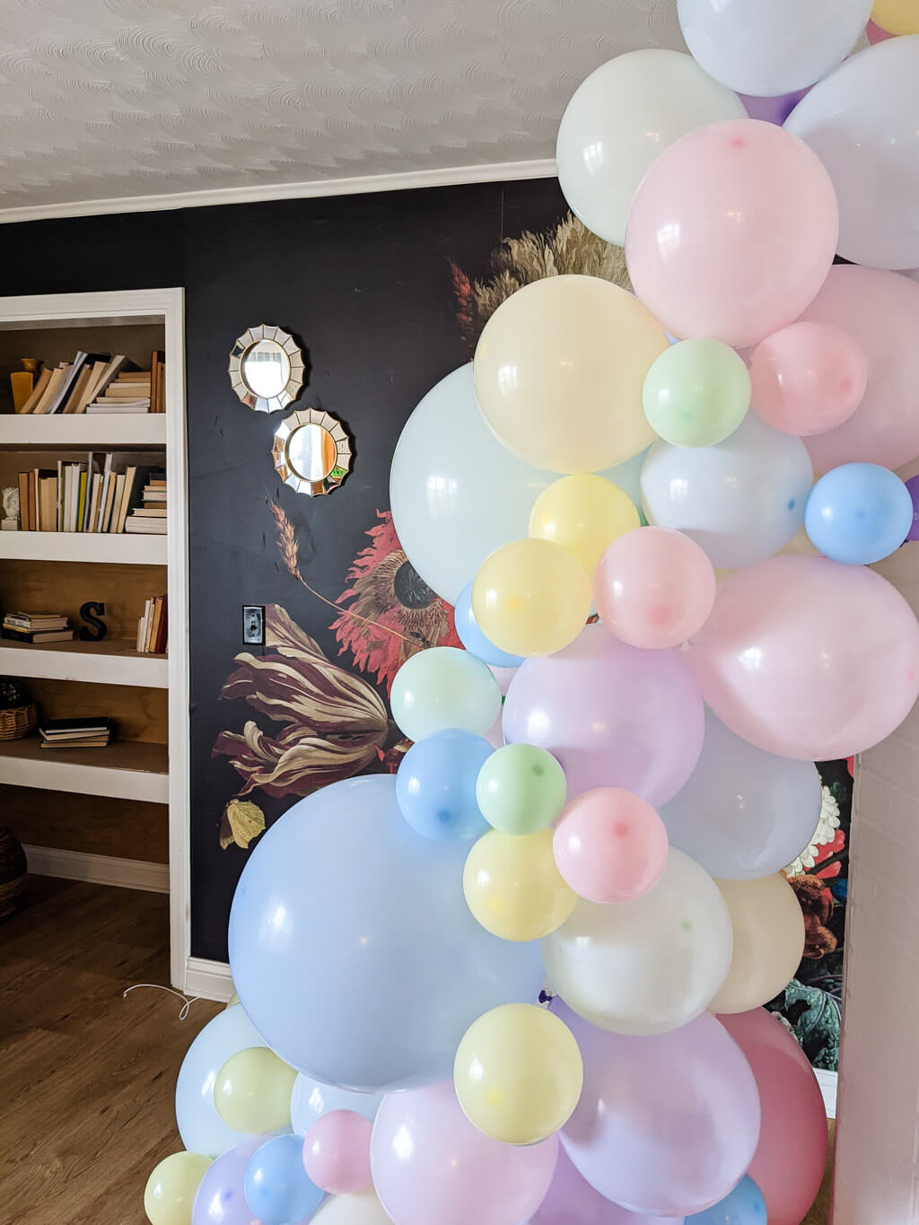 Pastel balloon garland on a wall birthday party decor