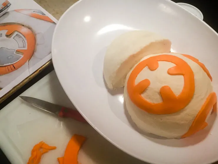Decorating a Star Wars BB-8 cake with fondant