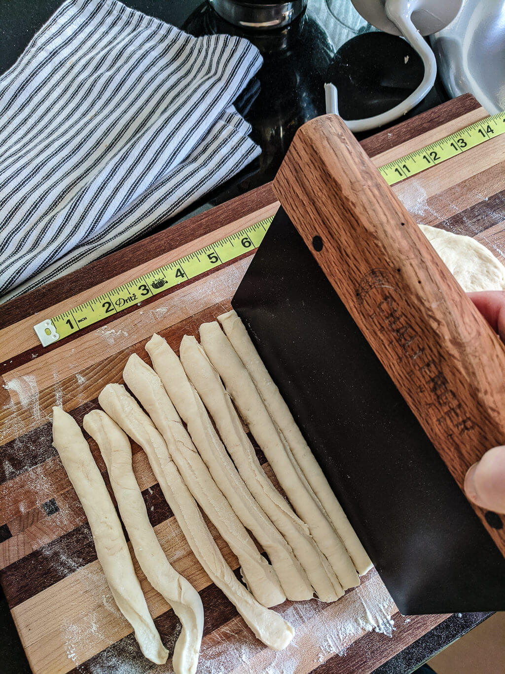 Cutting breadsticks dough into twists