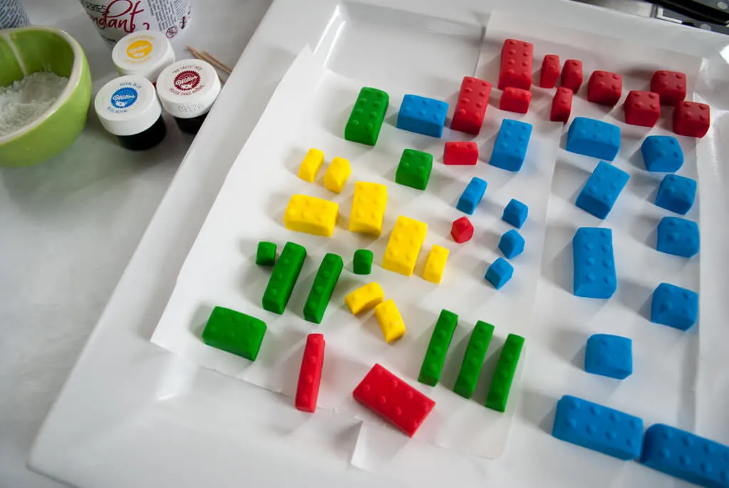 How to make fondant LEGO bricks for a LEGO birthday cake. Making fondant LEGOs is easy and fun, even for beginner cake decorators. #legobirthday #cakes #birthdaycake #legocake #legos #legobirthdayideas