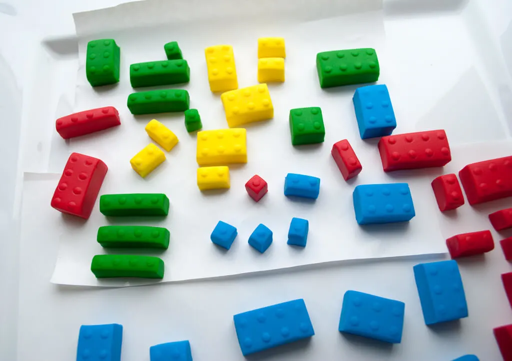 How to make fondant LEGO bricks for a LEGO birthday cake. Making fondant LEGOs is easy and fun, even for beginner cake decorators. #legobirthday #cakes #birthdaycake #legocake #legos #legobirthdayideas