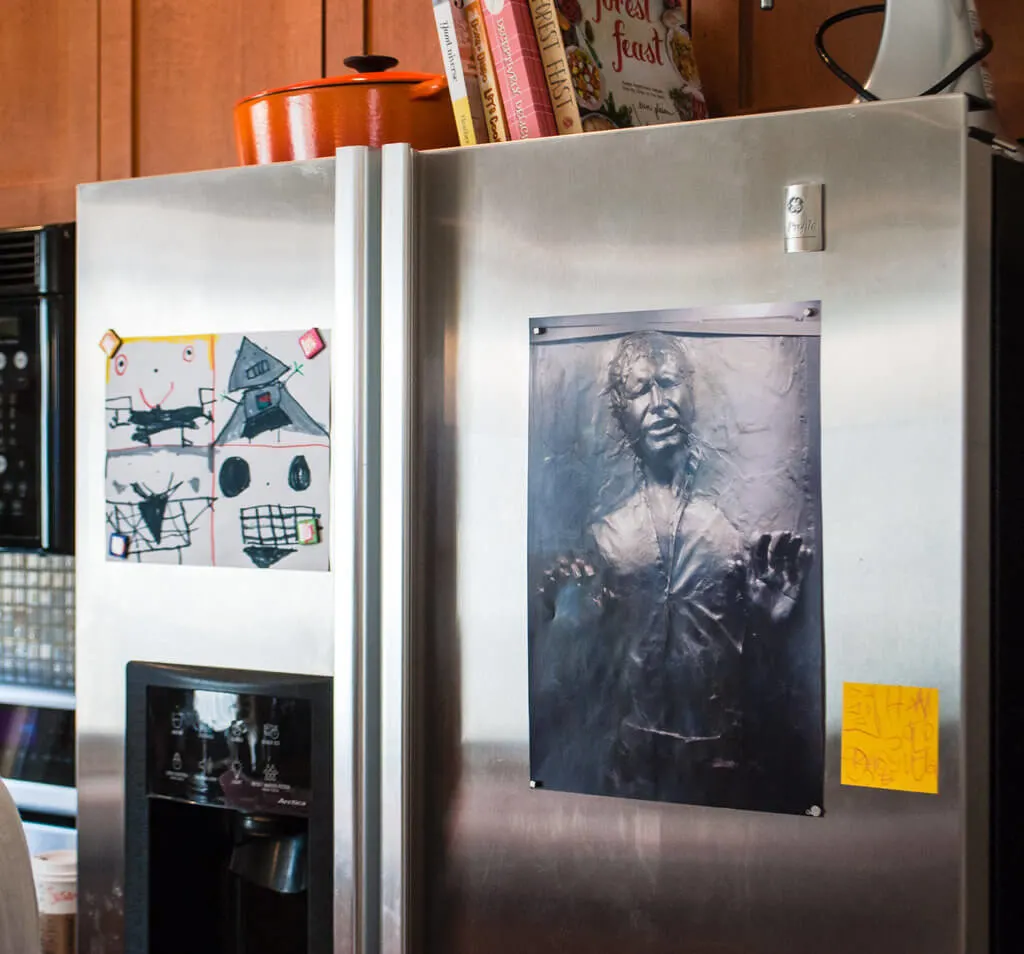 Han Solo frozen in carbonite Star Wars birthday party decoration on our stainless steel refrigerator