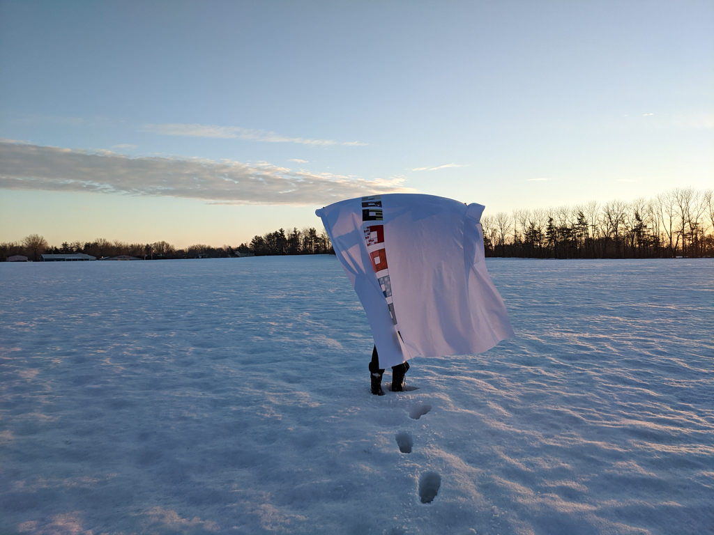 DIY baby clothes memory quilt top in the snow