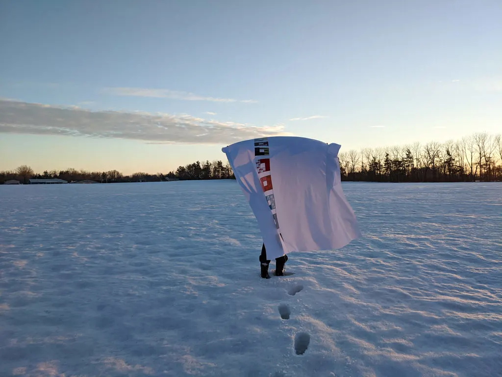 DIY baby clothes memory quilt top in the snow