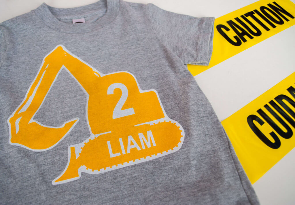 Make a DIY personalized construction birthday t-shirt for a modern construction birthday party. Just type to personalize, print, iron-on, and wear!