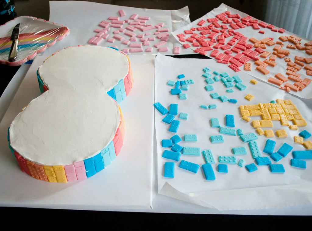 How to make thin fondant LEGO bricks for a LEGO Friends birthday cake. Making fondant LEGO blocks is easy and fun, even for beginner cake decorators. #legobirthday #cakes #birthdaycake #legocake #legos #legobirthdayideas