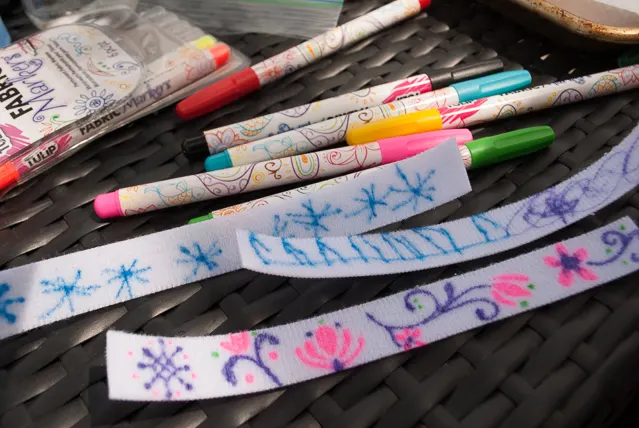 DIY Frozen charm bracelets. Great kid's activity for a Frozen birthday party or a Frozen Halloween costume idea