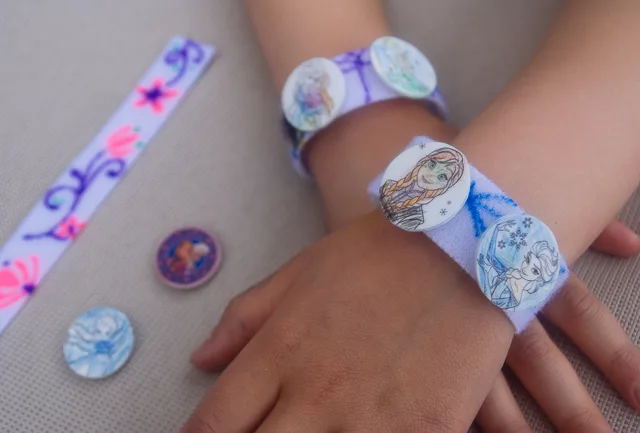 DIY Frozen charm bracelets. Great kid's activity for a Frozen birthday party or a Frozen Halloween costume idea